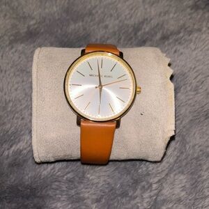 This is a gold and brown Micheal Kors watch!
